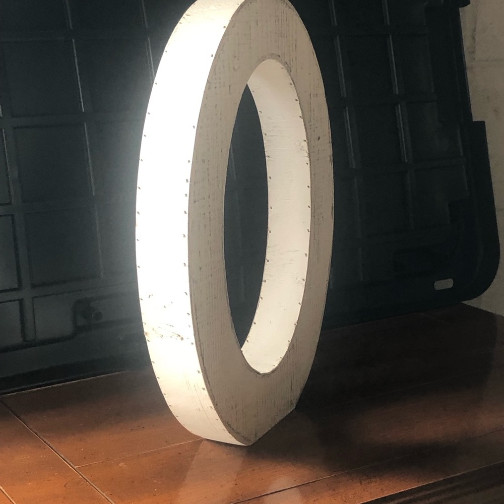 White wooden letter O. Can be used for home or wedding decor.